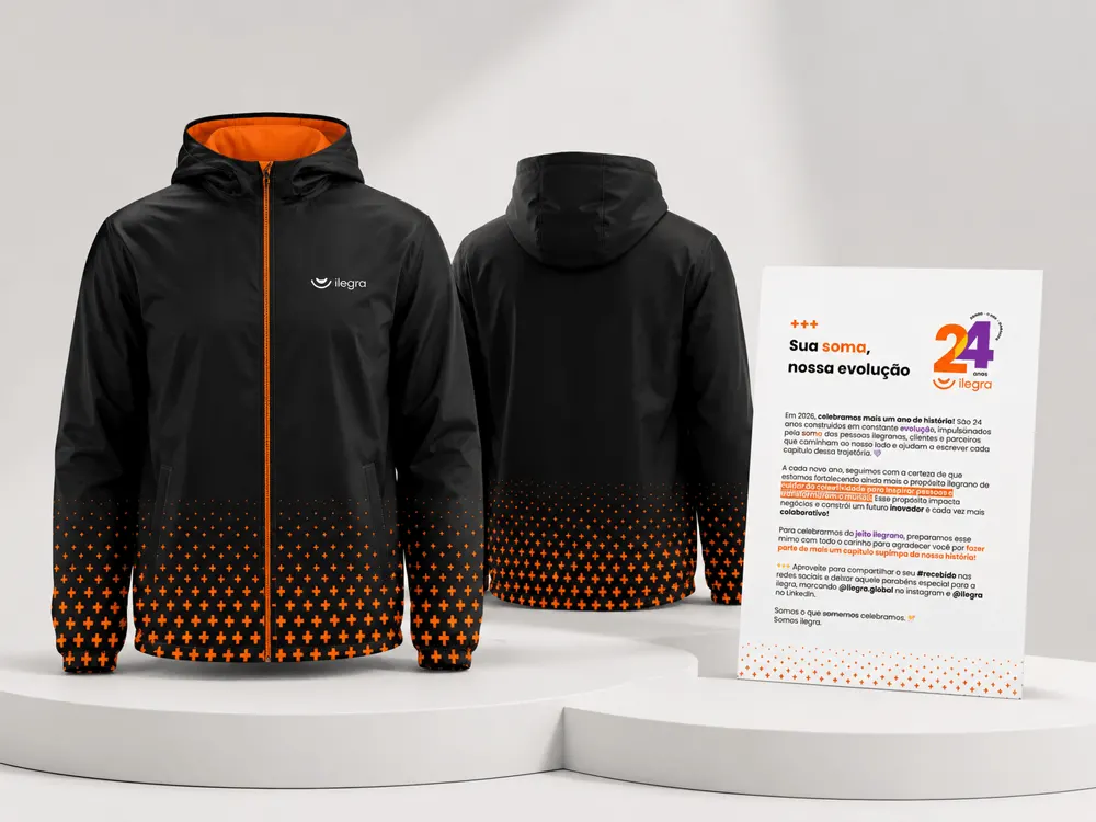Corta-vento personalizado da Ilegra em preto e laranja, com o cartão da campanha